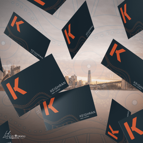 Multiple black and orange business cards for Keighran.