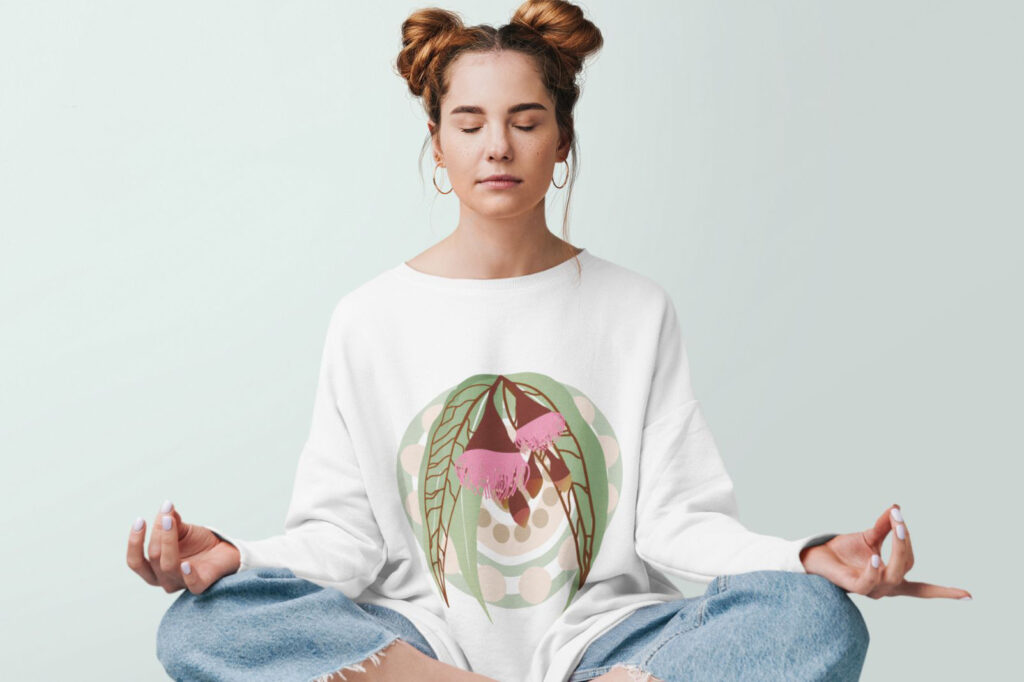 A picture of a girl sitting down meditating